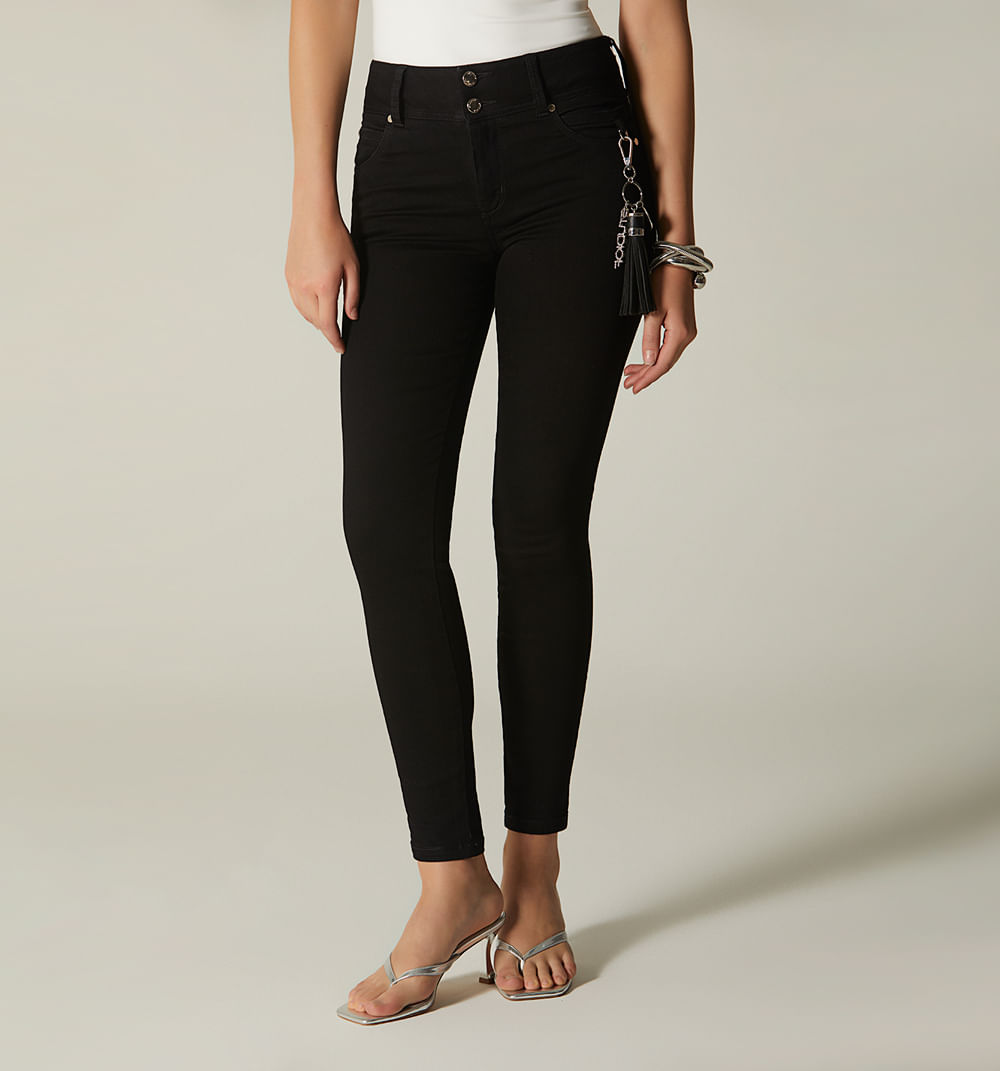 Jean skinny tiro medio bolsillos y borla